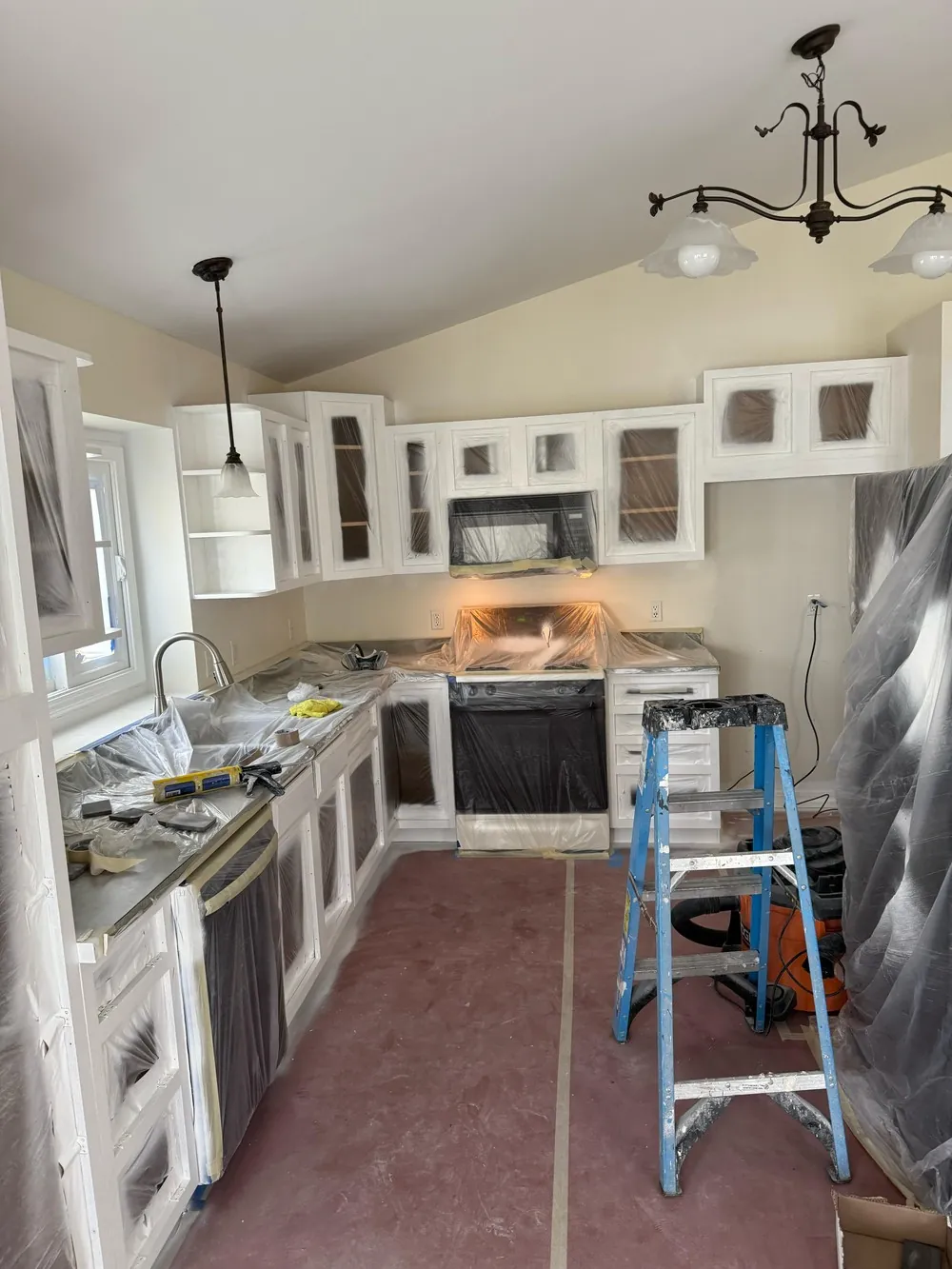 Kitchen with cabinets freshly painted white
